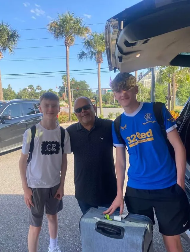 Pedro with two teenage riders and their suitcase after an MCO pickup